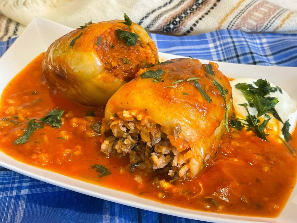 Easy and fast Bell peppers stuffed with rice and vegetables in tomato sauce