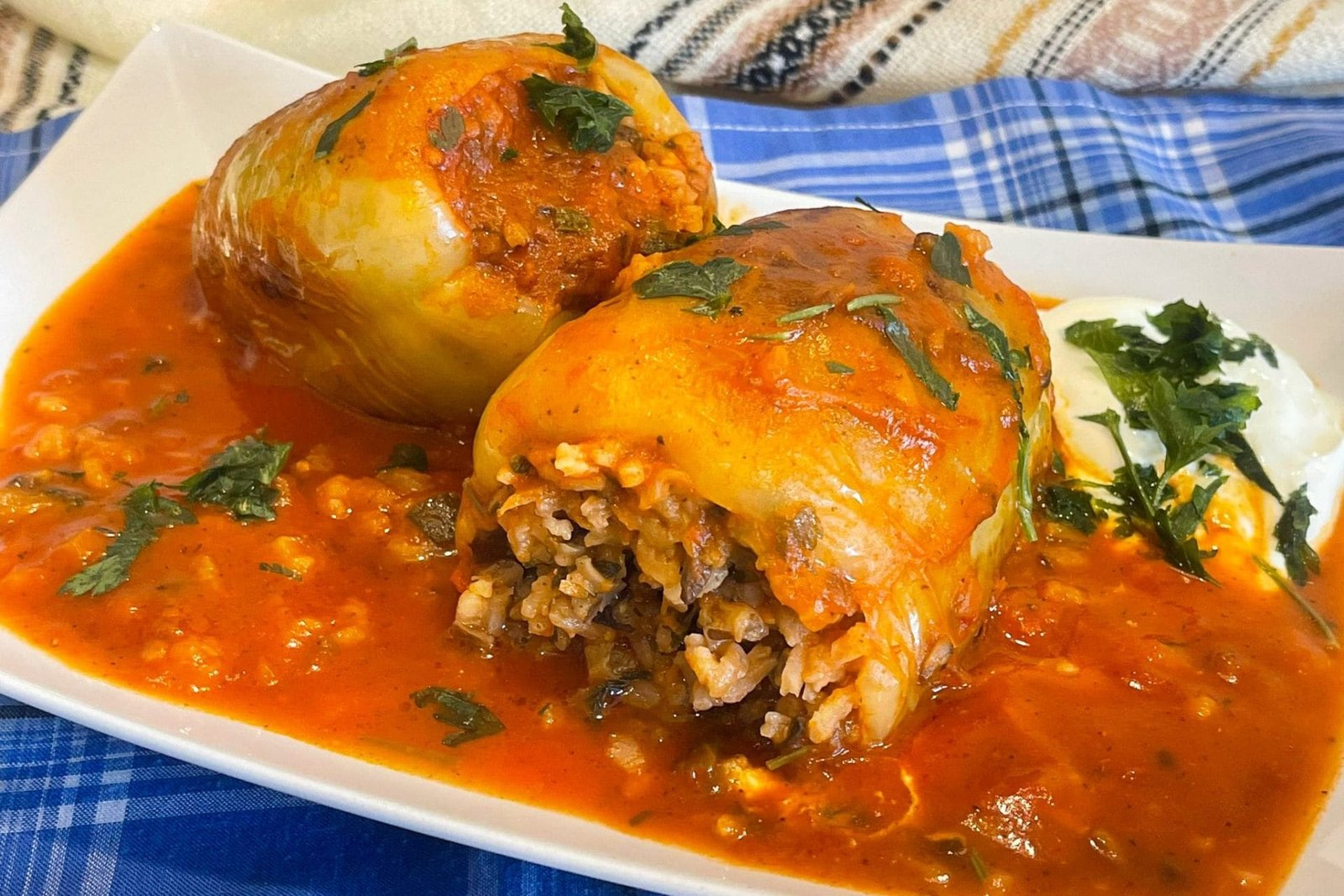 Easy and fast Bell peppers stuffed with rice and vegetables in tomato sauce