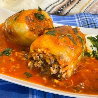 Easy and fast Bell peppers stuffed with rice and vegetables in tomato sauce