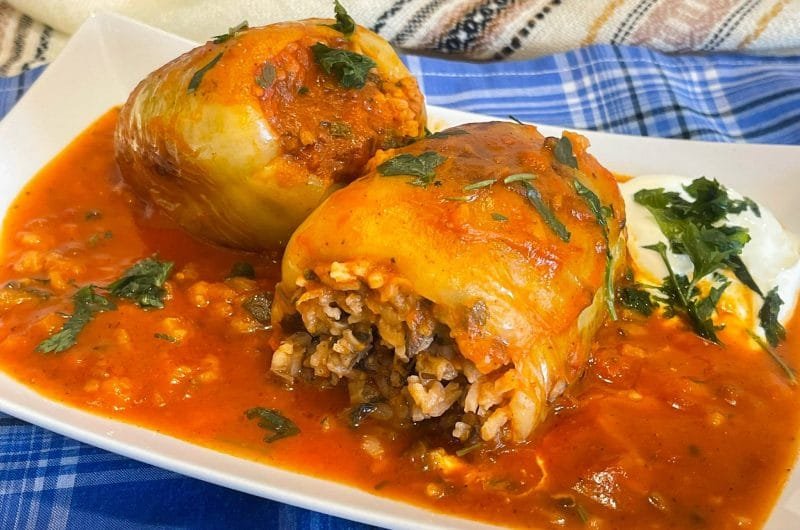 Easy and fast Bell peppers stuffed with rice and vegetables in tomato sauce