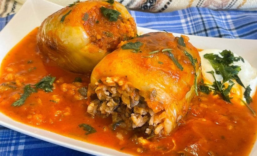 Easy and fast Bell peppers stuffed with rice and vegetables in tomato sauce