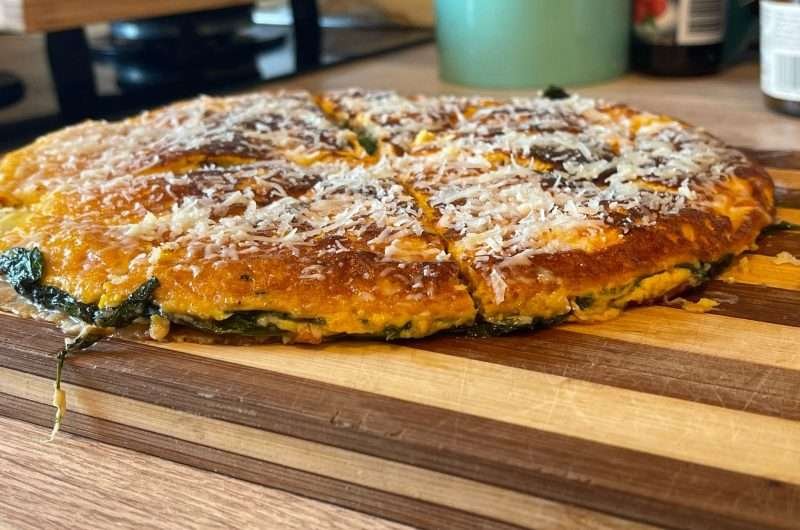 Omelette with flatbread, baby spinach and cheese