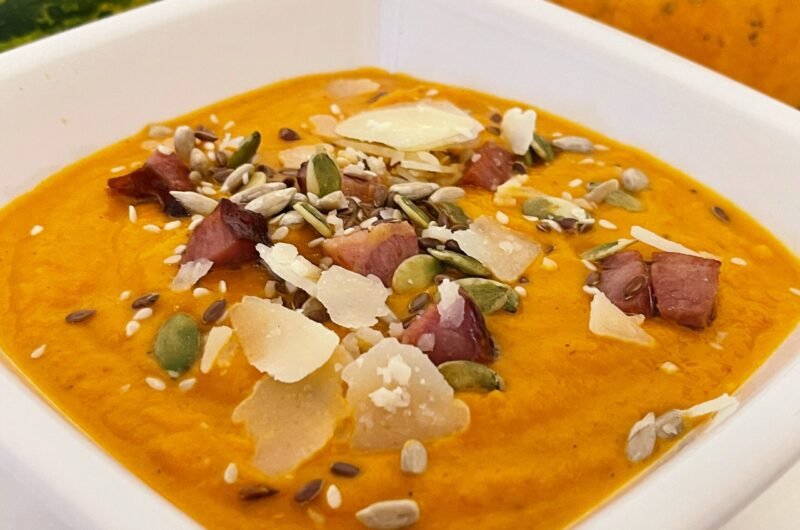 Flavored Pumpkin soup with smoked sausages and bacon