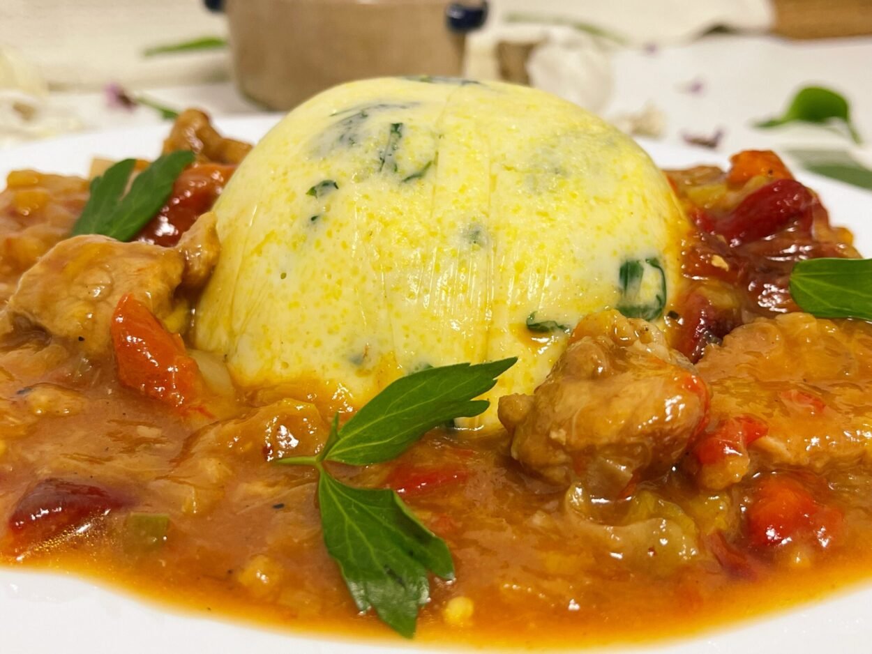 Pork stew with roasted peppers and creamy spinach polenta with parmesan