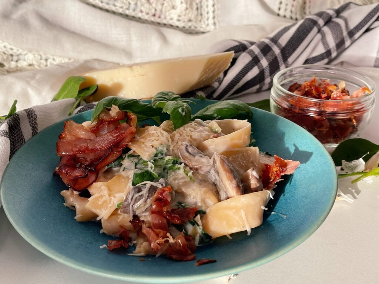 Delicious Pasta With Mushrooms And Spinach In White Sauce