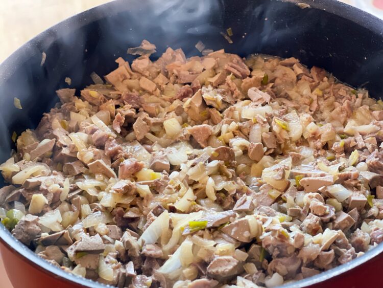 cooked onion and boiled chopped chicken and gizzards for the Romanian Cauldron Stuffing – A Recipe Passed Down from My Grandmother