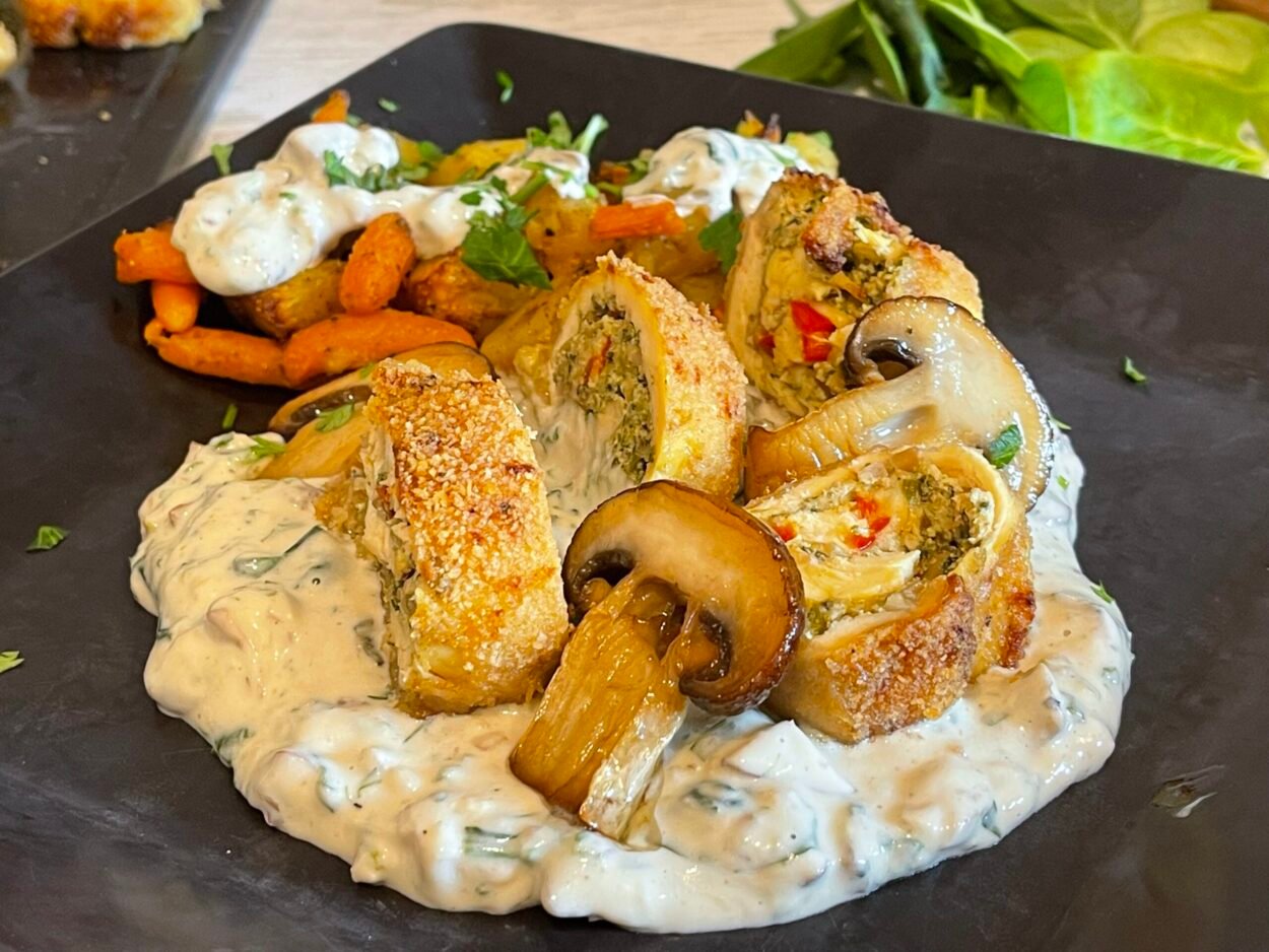 Chicken Roulade with Herbs and Nuts in Creamy Mushroom‑Spinach Sauce