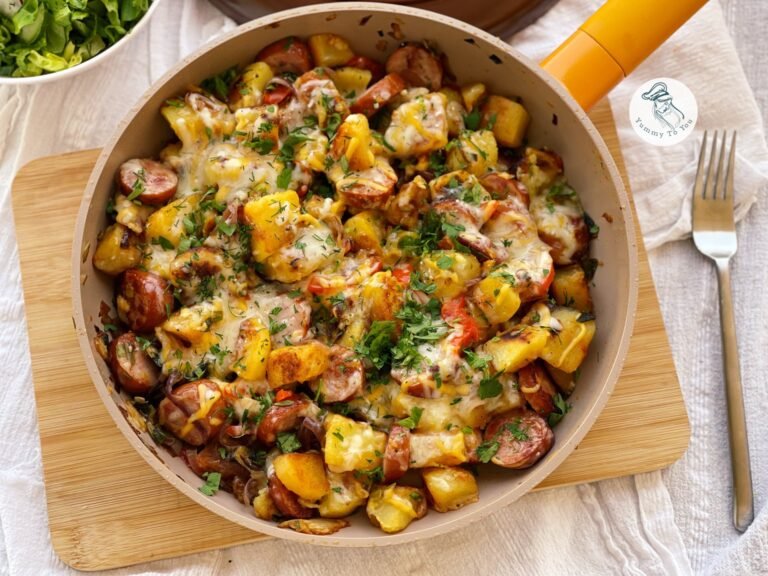 Rustic potatoes with sausages and onions
